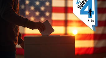 Person casting a vote into an election box, with American flag in the background